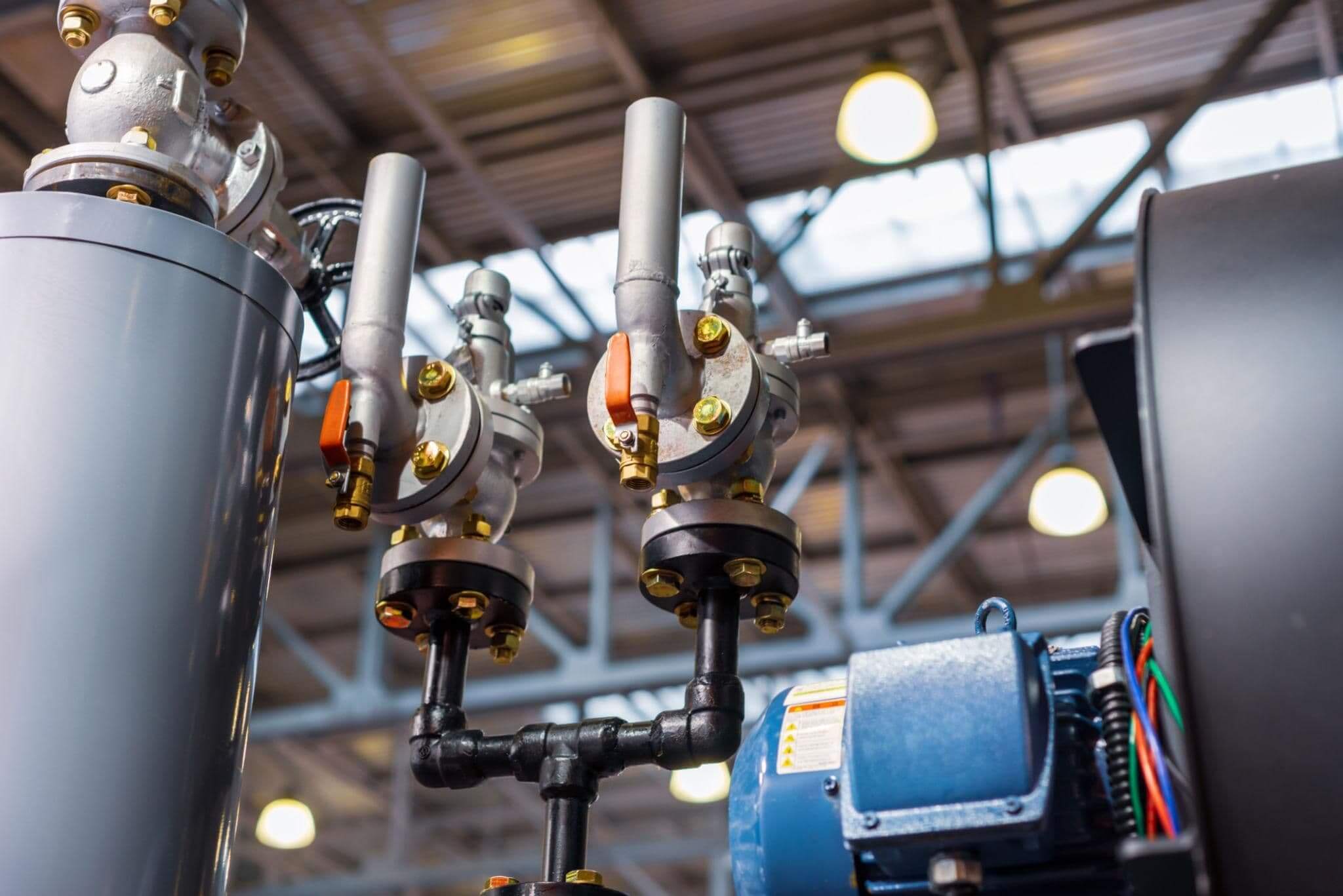 Industrial valve selection guide featuring ball and butterfly valves in a machinery setup.