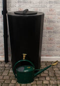 Midi Metro 185L Water Butt - Black Slim Cylindrical Tank with a green watering can beside it