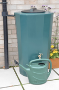 Midi Metro 185 Litre Water Butt - Green Cylindrical Tank alongside a green watering can in a garden setting.