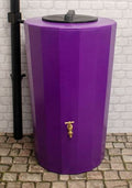 Midi Metro 185 Litre Water Butt - Purple Slim Cylindrical Tank on cobblestone with a black lid and tap.