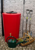 Midi Metro 185 Litre Water Butt - Red Slim Cylindrical Tank with garden tools and watering can.