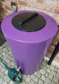 City Just Water 210L Water Butt - Purple Cylindrical Design on a stone patio.