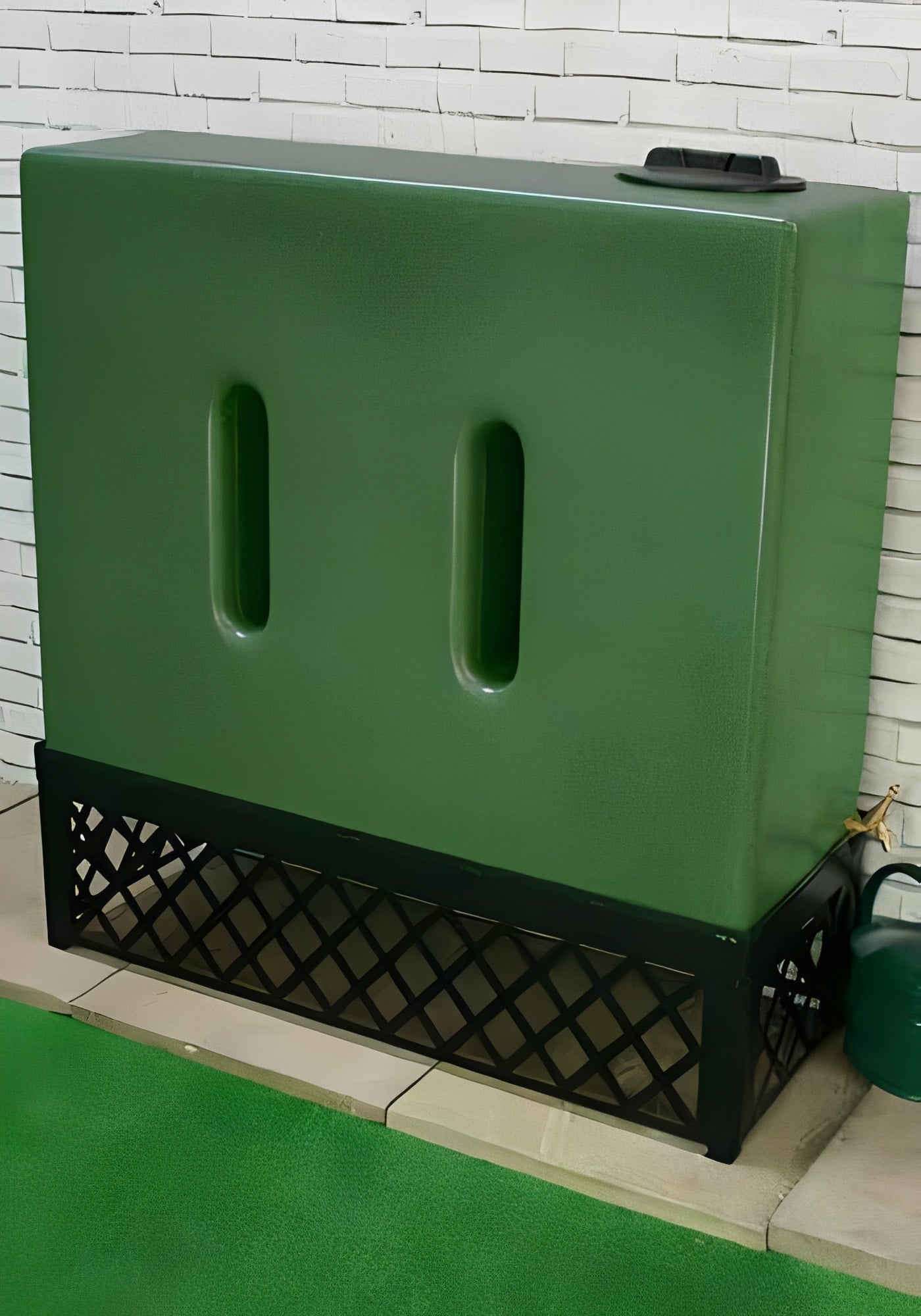 500 Litre Water Tank V1 - Green Marble displayed on a decorative black stand against a brick wall.