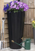 Cosmo 200L Water Butt Planter - Black Decorative Storage with purple flowers and gardening tools