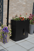 Black Oasis 375L Water Butt Planter - Black Cylindrical MDPE with blooming flowers and stylish design.