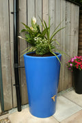 Blue City 180L Water Butt Planter - Decorative Rainwater Tank with plants in a vibrant blue cylindrical design.
