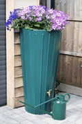 Green Cosmo 200L Water Butt Planter - Decorative Green with purple flowers and watering can in a garden setting.