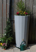 Grey Metropolitan 2-in-1 Water Butt Planter - 255L Grey with colorful plants and green watering can