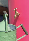 Pink Big City Water Butt Planter - 380L Capacity with green watering can and brass tap.