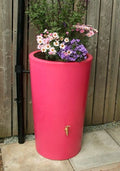 Pink City 180L Water Butt Planter - Decorative Rainwater Tank with vibrant flowers in a bold pink finish.