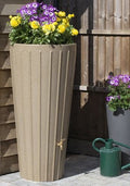 Sandstone Cosmo 200L Decorative Water Butt Planter - Stone Effect with vibrant flowers on top.