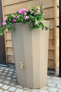 Midi Metropolitan 165L Water Butt Planter - Sandstone with vibrant flowers in the integrated planter bowl.