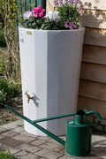 White Marble Midi Metropolitan Water Butt Planter - 165L with flowers and green watering can